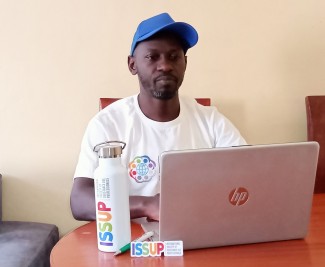Sammy Ombisa INEP Global Master Trainer. Sammy Ombisa branded with ISSUP logos preparing INEP facilitation at his grassroot office in Nairobi Kenya.